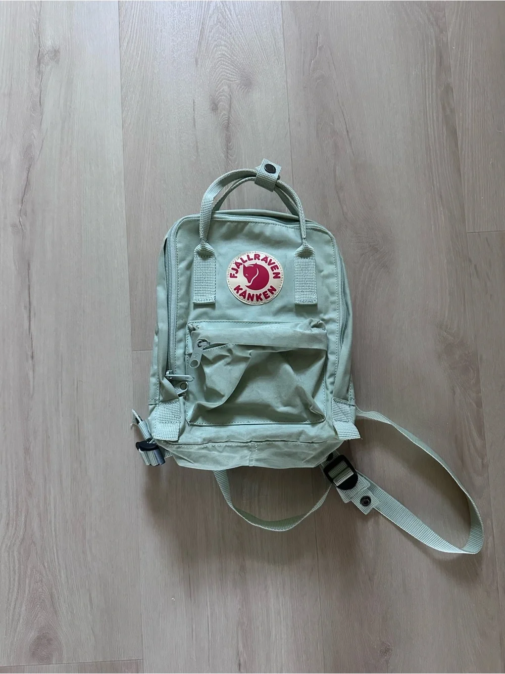 Fjällräven Kånken Mini Backpack - Light Sage Green with Red Logo